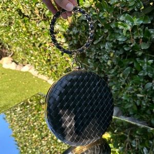 Black and gold woven wristlet purse